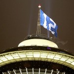 A Seattle Seahawks "12th man" flag, representing the fans, flies over the Space Needle.