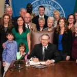 Stuber, Inslee and others at bill signing
