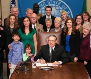 Stuber, Inslee and others at bill signing