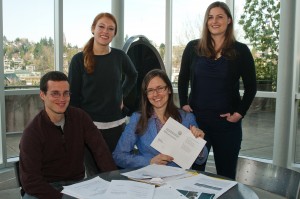 students at table with papers