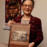 Judy Tsou, head of the UW Music Library, with a copy of Benjamin Britten's opera "Peter Grimes." The score is part of a large donation to the UW by the estate music collector William Crawford III.