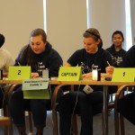 Students writing at table