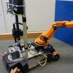 The robot has a mounted camera and router to transmit the robot’s view of the scene, and built-in haptics technology allows the operator to receive force feedback from the robot.