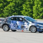 Members of the UW team test their car during the competition.