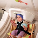 A year-old baby sits in a brain scanner, called magnetoencephalography -- a noninvasive approach to measuring brain activity. The baby listens to speech sounds like "da" and "ta" played over headphones while researchers record her brain responses.