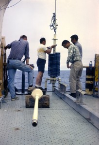 people placing corer on boat