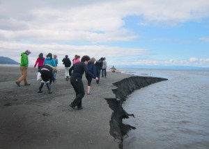 students walking on sand