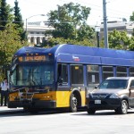 a bus on the street stopped at a bus stop
