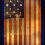 The flag that inspired Francis Scott Key to write what would become "The Star Spangled Banner," shown on display at the Smithsonian's National Museum of History and Technology, around 1964. Many pieces were cut off the flag and given away as souvenirs early during its history. A linen backing, attached in 1914, shows the original extent of the flag.