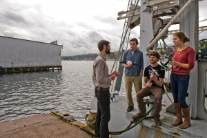 researchers standing on boat