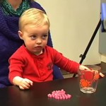 A toddler reacts after an adult has expressed "annoyance" at the behavior of another adult.