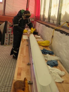 photo of person in tent bending over ice core