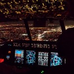 view of city lights out cockpit window