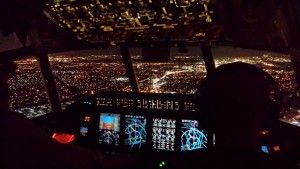 view of city lights out cockpit window