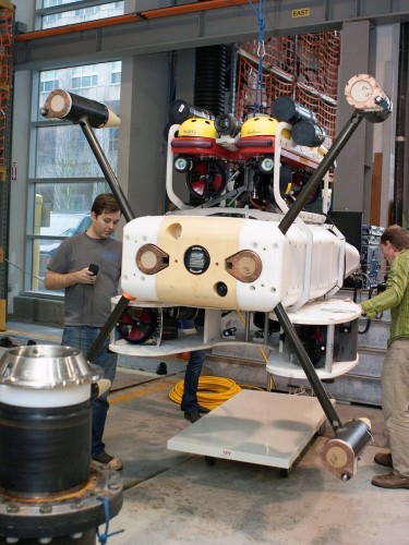The monitoring instruments are housed inside the white box in the middle. The Millennium Falcon ROV is positioned just over and under the white box. Researchers tested the device's ability to fasten onto a docking station underwater, seen foreground.