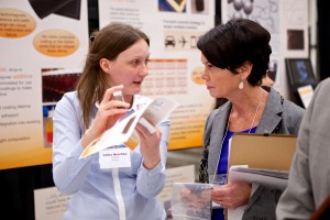 Volha Hrechka, CEO of PolyDrop, speaks with a judge at the 2013 Environmental Innovation Challenge. Her team won the $10K Grand Prize.