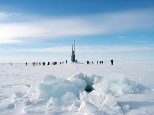 submarine poking through ice and people disembarking