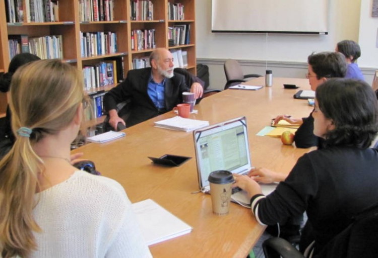Students participate in a discussion with Sanford Schram, a professor at New York's Hunter College, after his lecture on campus in April 2014.