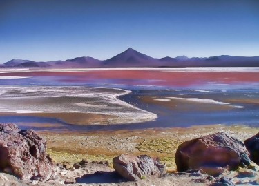 Laguna Colorada is a shallow salt lake in the southwest of Bolivia. One of several places on Earth whose colors are dominated by nonphotosynthetic pigments. Eddie Schwieterman of the University of Washington has research on how such nonphotosynthetic biosignatures might appear on exoplanets, or those outside our solar system.