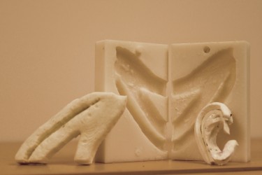 The UW team used a 3-D printer to create a negative mold of a patient's ribs from a CT scan. Surgeons take pieces of those ribs and "carve" them into a new ear.