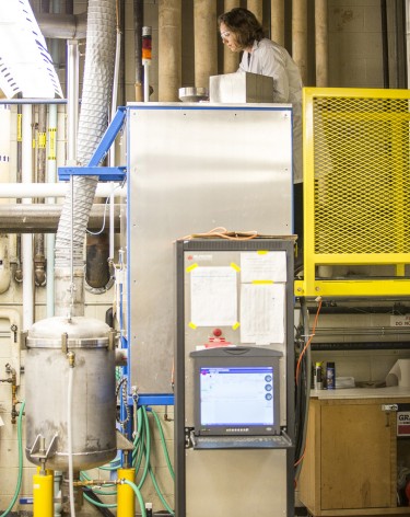 Shannon Ewanick with the UW's Biofuels and Bioproducts Laboratory operates a pretreatment reactor, known as a "steam gun."