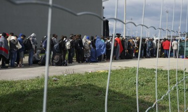 Syrian refugees cross the border between Hungary and Austria on their way to Germany and Hungary on Sept. 6, 2015.