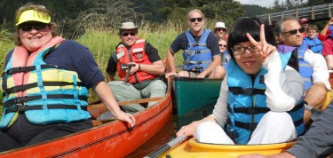 people in canoes