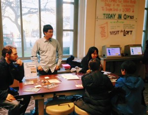 people playing a board game
