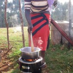 Photo of woman testing stove in Kenya