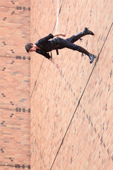 Rachael Lincoln was assisted in performing "Man Walking Down the Side of a Building" by Derrick Lindsay, who worked the ropes.