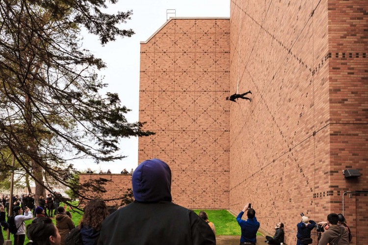 Rachael Lincoln, UW dance lecturer and member of the BANDALOOP dance company, performs "Man Walking Down the Side of a Building," by choreographer Trisha Brown on the west side of Meany Hall for the Performing Arts on Friday, Feb. 5. She was assisted from above by a colleague with BANDALOOP.
