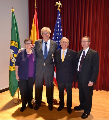 Anthony Geist, UW professor of Spanish and Portuguese studies, is honored with a knighthood by the Kingdom of Spain April 16 in Brechemin Auditorium. From left, UW President Ana Mari Cauce; Geist; Luis Fernando Esteban, Spain's honorary consul in Washington state; and UW Dean of Arts & Sciences Robert Stacey.
