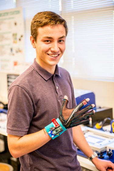 UW sophomore Thomas Pryor demonstrates the "SignAloud" gloves that he developed with fellow student Navid Azodi, which can translate American Sign Language into text and speech.