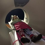 Young boy in brain scanning machine