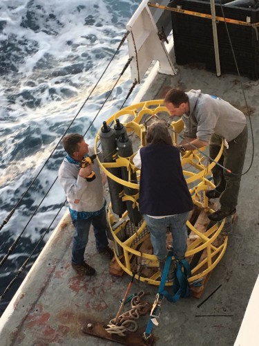 three researchers on boat