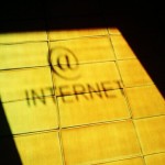 Internet sign reflected on tile floor