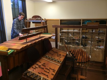 Charles Corey, UW affiliate assistant professor of music and curator of the Harry Partch instrument collection in residence here, plays Partch's Bass Marimba. The other Partch creations in the room are the Kithara II in the back left, the Harmonic Cannon II in front center, the Diamond Marimba to the right and the extraordinary Cloud Chamber Bowls in the back. Several Harry Partch instruments -- including the Cloud Chamber Bowls -- were used by Paul Simon for a song on his new album, "Stranger to Stranger."