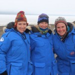 three people in blue coats