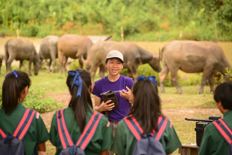 Pensri “Elle” Kyes, Randy Kyes' collaborator and wife, with students during an educational outreach program in Thailand.