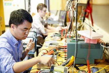 two students with wires