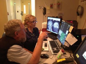 Two scientists at a computer.
