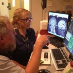Two people looking at a computer