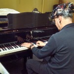 UW Music School Director Richard Karpen plays an electromagnetic piano called a Disklavier. Though he is shown performing on the keys, some of the music for the April 6 DXARTS Spring Concert will be played hands-free, with only the EEG.