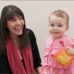 Research scientist Tanya St. John works with a baby at the University of Washington Autism Center.
