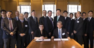 UW President Ana Mari Cauce and Tohoku University President Susumu Satomi (both seated) at the signing ceremony, with officials from the UW and Tohoku University, as well as representatives of the Japanese government