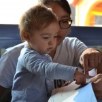 UW student Jinnie Yi works with a toddler at one of the participating infant education centers in Madrid. A study by the UW Institute for Learning & Brain Sciences shows that infants and young children can develop bilingual skills through interactive learning.