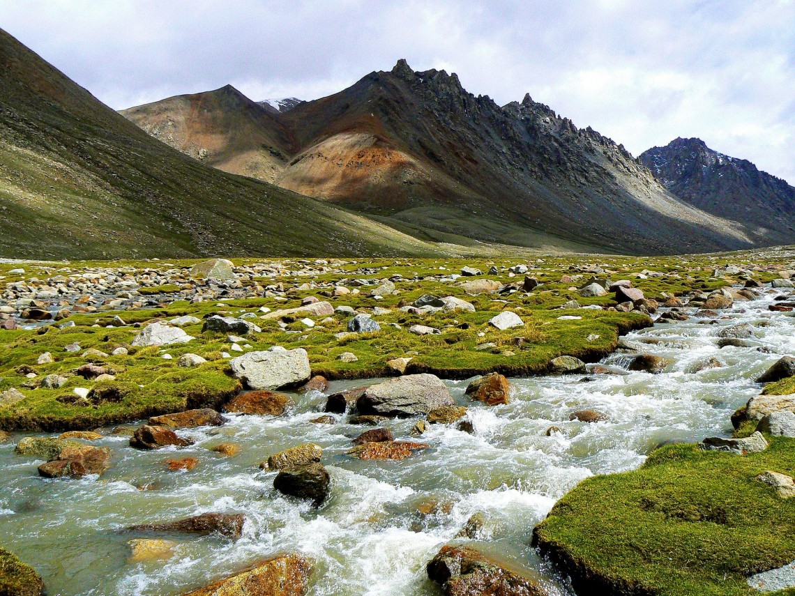 river flowing through mountain valley