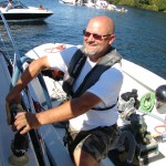 Terry Durfee pumps out a bilge on Lake Washington.
