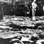 A cleaner sweeps the floor after the Wall Street crash of 1929.