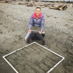 person sitting on sand
